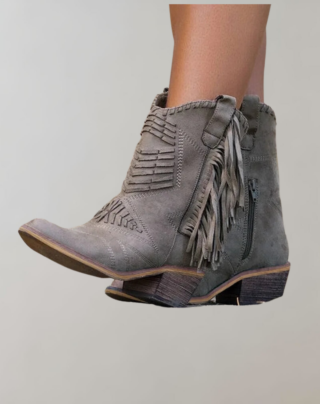 Grey women's ankle boot with side tassels and intricate stitching