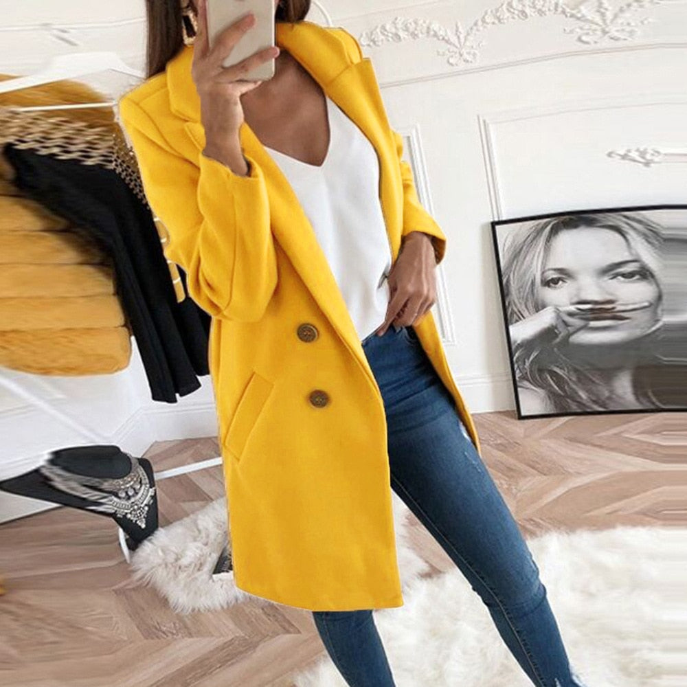 Woman wearing stylish yellow winter coat with button closure