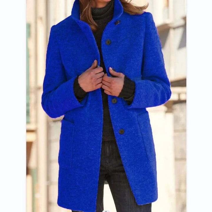 Close-up of the stylish blue Emma winter overcoat button design