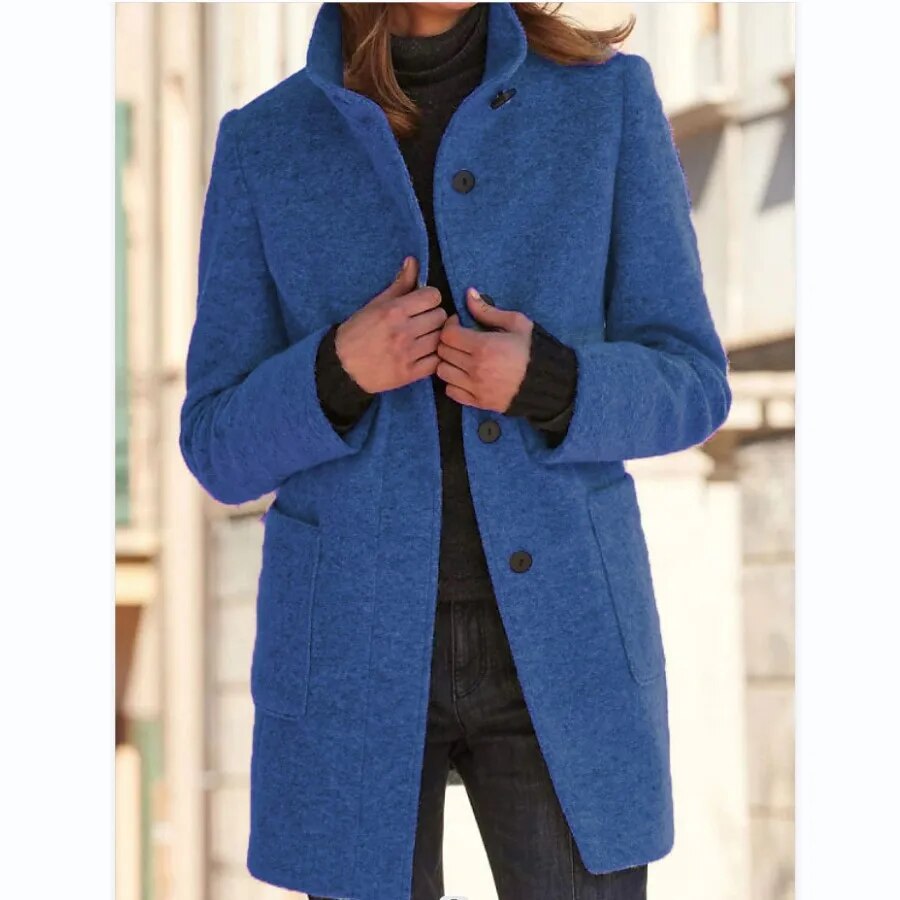 Woman wearing the Emma winter overcoat in royal blue