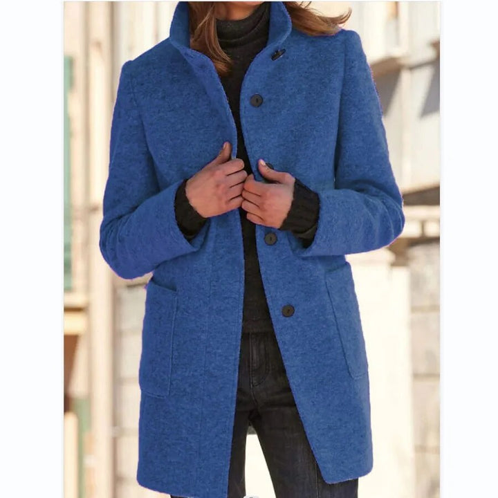 Woman wearing the Emma winter overcoat in royal blue