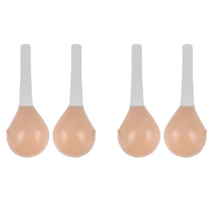 Pair of nude adhesive bra cups with lifting straps