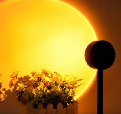 LED sunset projection lamp casting vibrant colors on a bedroom wall