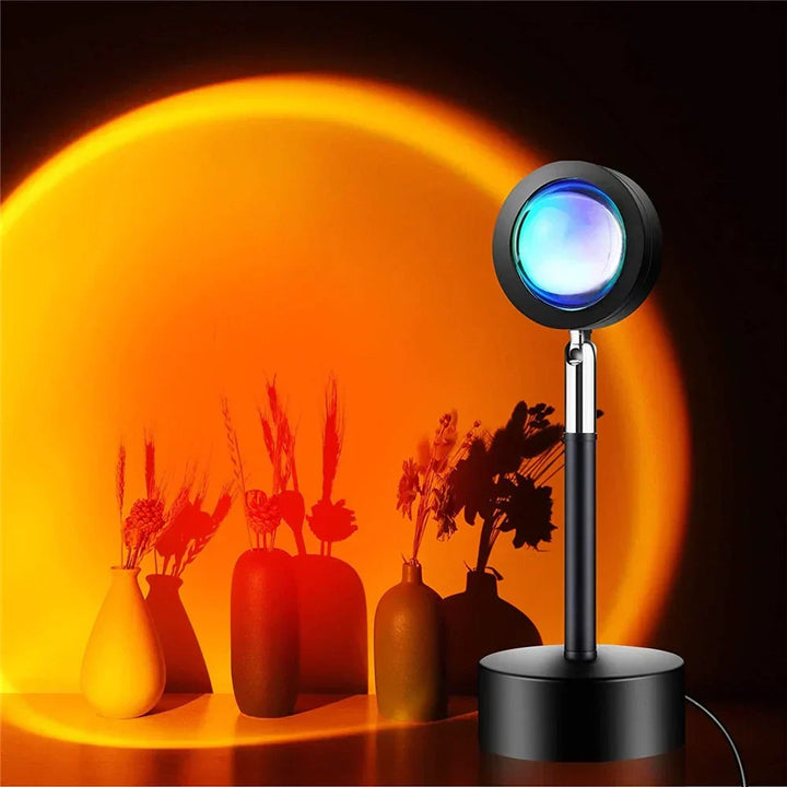 GlowSphere sunset lamp projecting warm orange light onto a wall