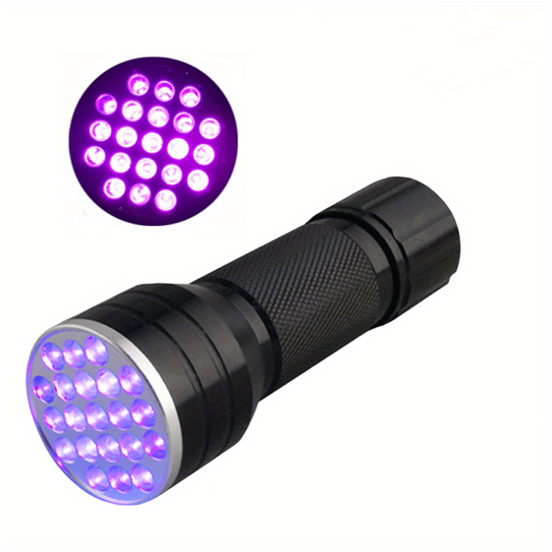 Close-up view of the purple UV LED bulbs on a black flashlight head