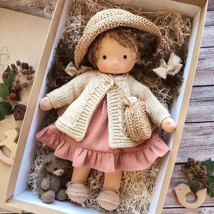Greta style cuddly doll in a gift box with a pink dress
