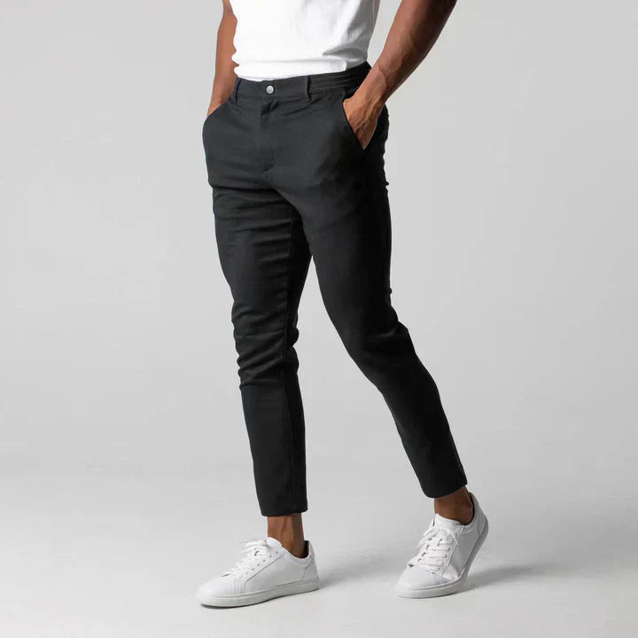 Man wearing Sylvester men's slim fit black chino pants with clean modern cut