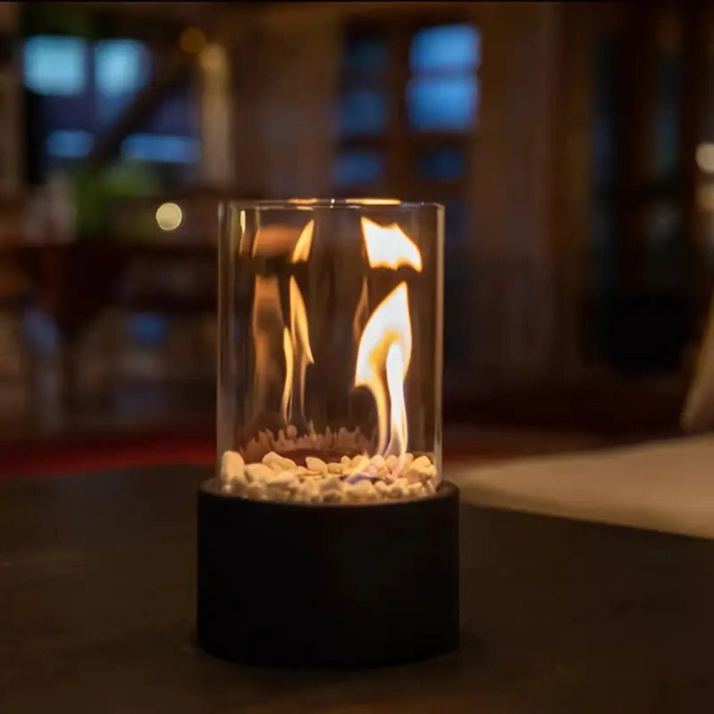 Modern indoor fire pit on wooden table adding stylish home decor and warmth