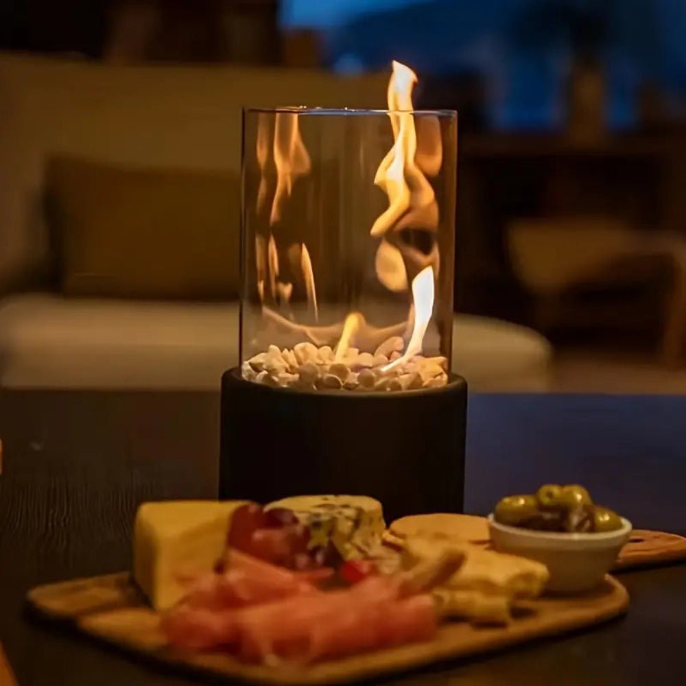 Compact bioethanol fire pit burning brightly on a patio table at dusk
