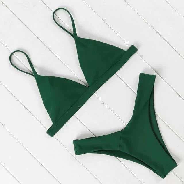 Flat lay of summer fashion triangle bikini swimwear in neutral lighting