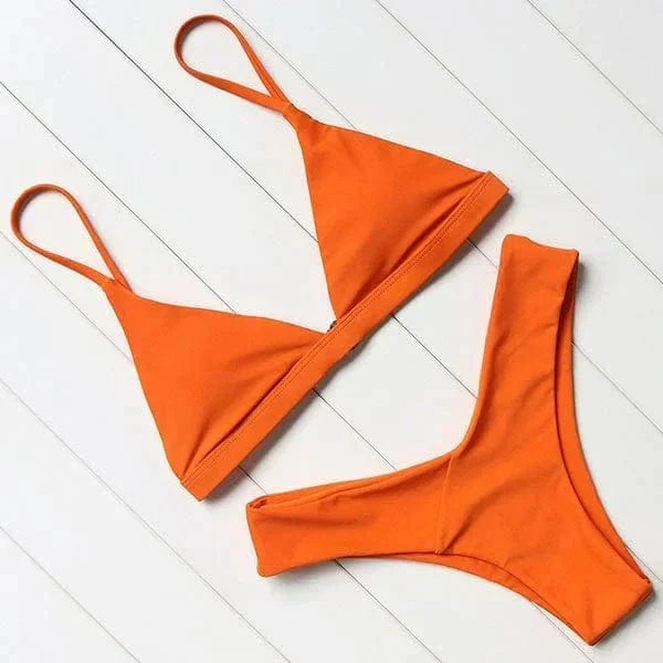 Womens triangle bikini set paired with resort wear for summer fashion look