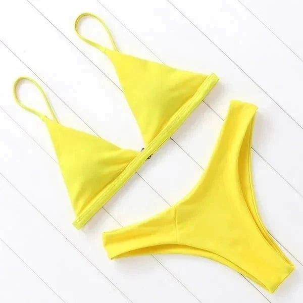 Flat lay of the bright yellow triangle bikini set with adjustable straps