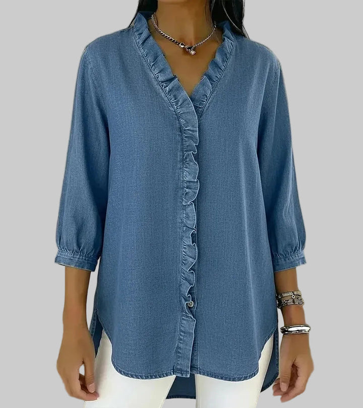Detailed shot of the ruffle trim on the V-neck women's fashion blouse