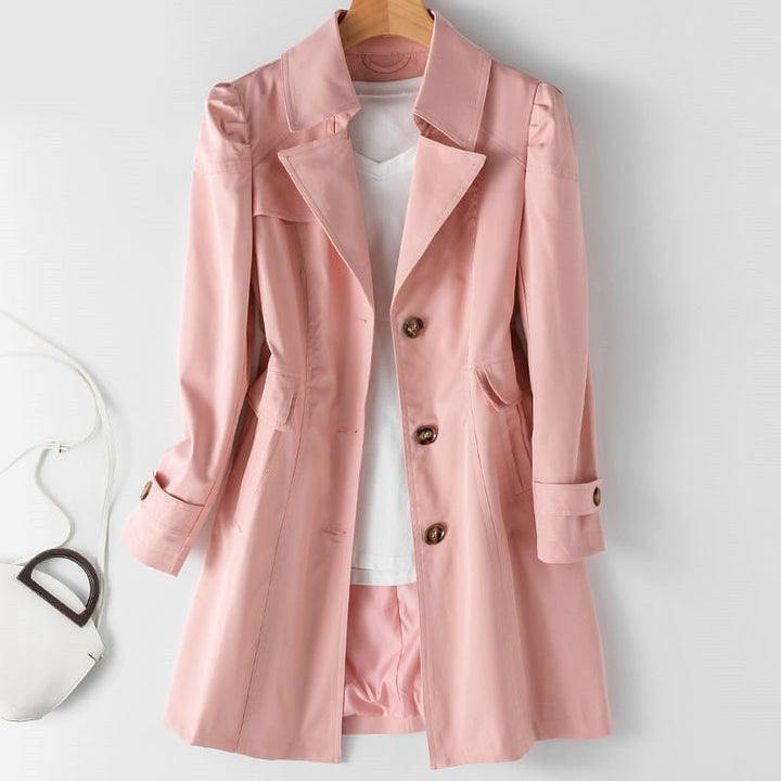 Close up view of the fabric and button details on the stylish womens trench coat