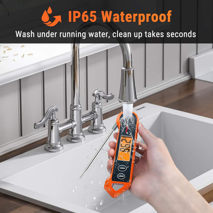 Waterproof digital thermometer being washed under kitchen faucet
