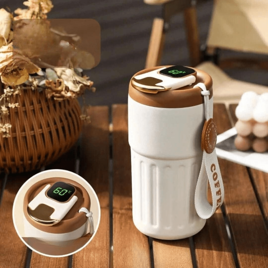 Smart temperature display thermos water bottle in brown standing on wooden table next to basket