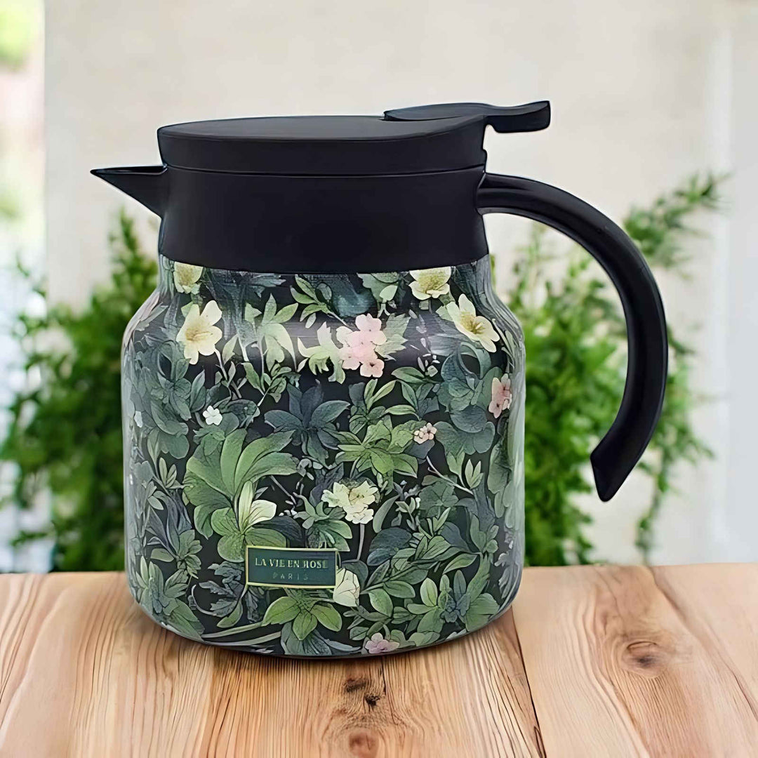 Green floral stainless steel tea thermos with black lid and handle