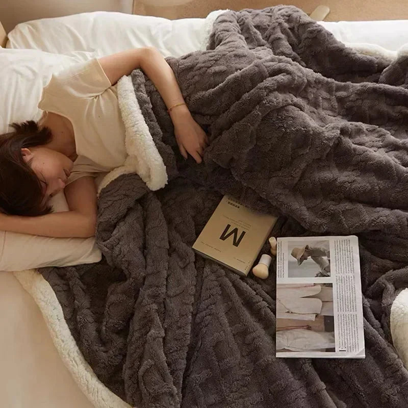 Luxurious warm blanket in neutral tone styled on a living room sofa