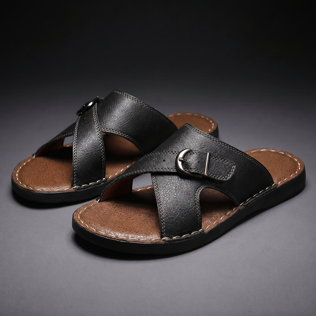 Men's black criss-cross buckle slides displayed on a dark background