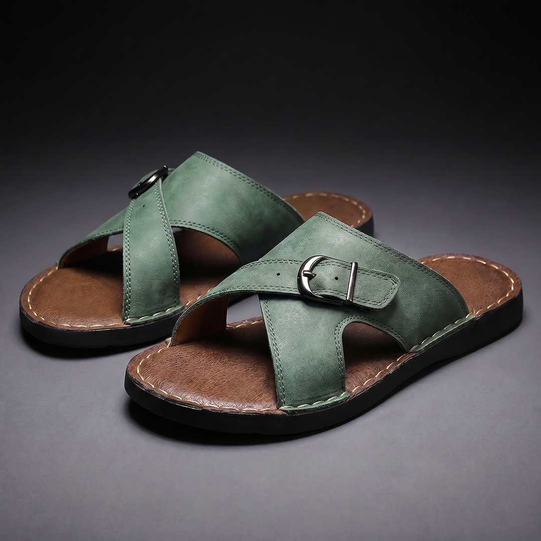Men's green criss-cross buckle slides highlighting the contoured footbed