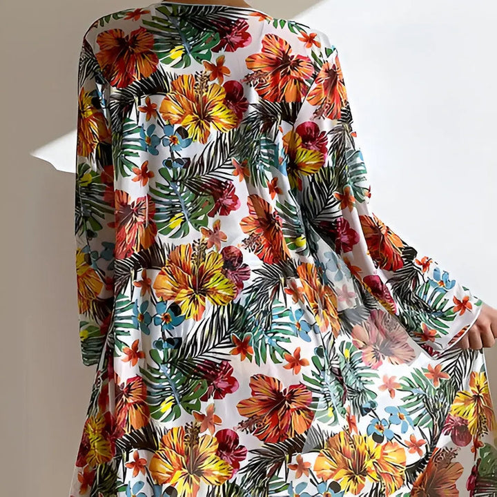 Back view of the vibrant floral patterned beach cover-up and swimwear set
