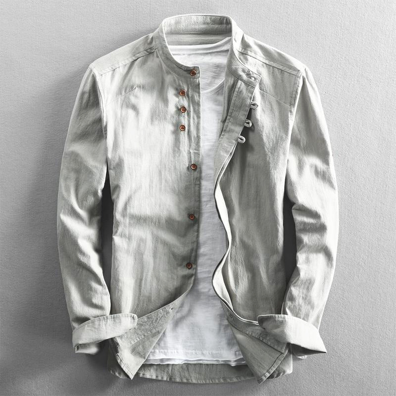 Gray men's mandarin collar long sleeve casual shirt layered over a white t-shirt