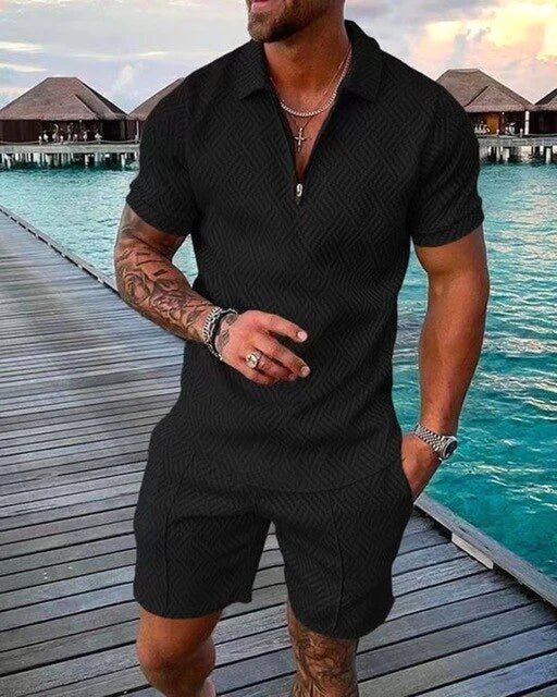 Man wearing a black polo and shorts coordinated summer set outdoors