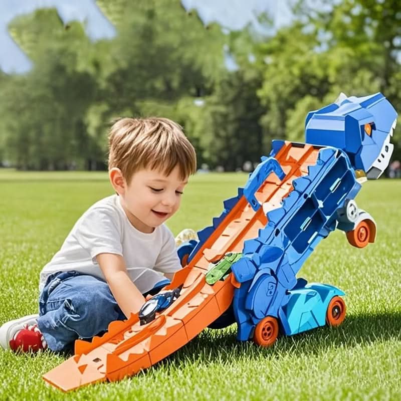 Young boy playing with blue transforming dinosaur car toy outdoors on grass
