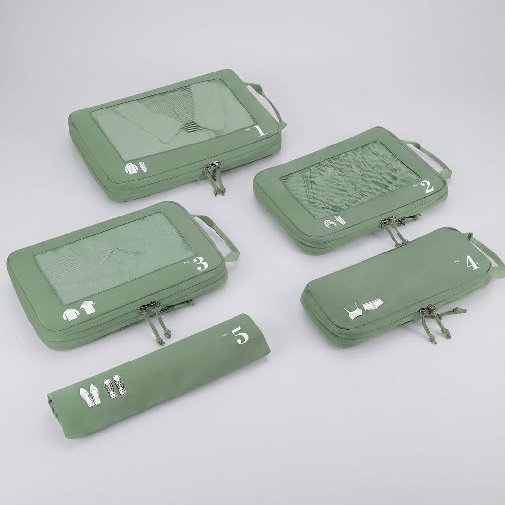Five green compression packing cubes laid out flat with mesh windows