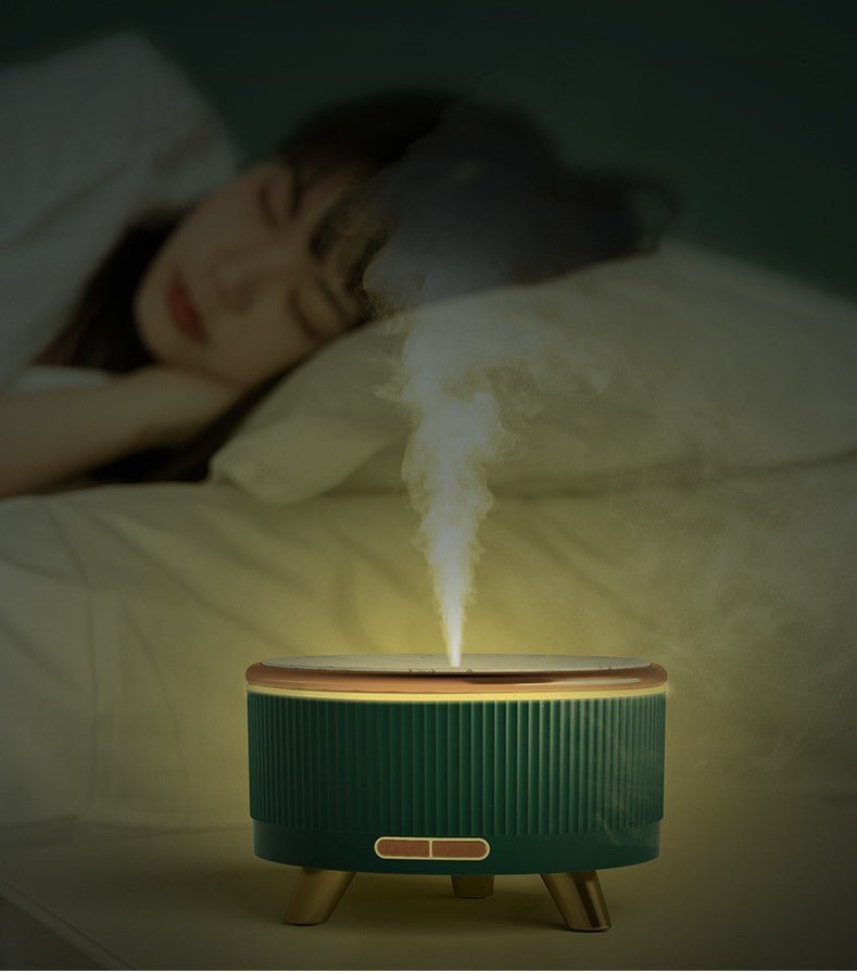 Whisper-quiet aroma diffuser glowing softly on a bedside table while someone sleeps