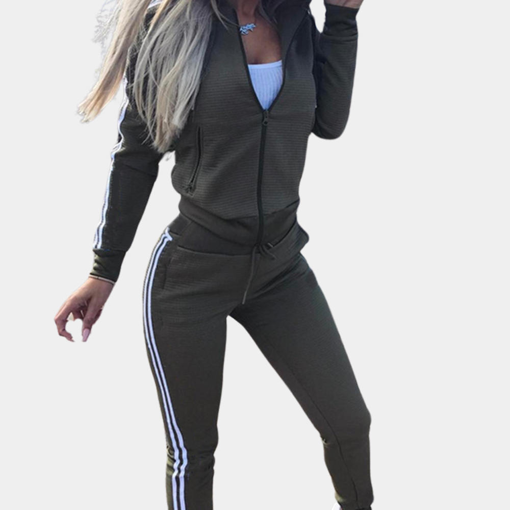 Woman wearing an olive green two-piece tracksuit with zipper and hood