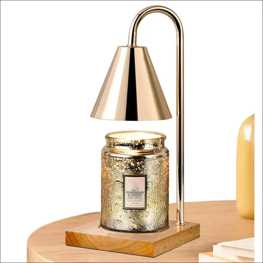 Sophia candle warmer lamp in white finish glowing over a jar candle