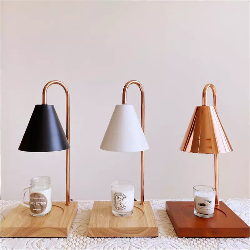 Three Sophia candle warmer lamps displayed side by side in black, white, and brown