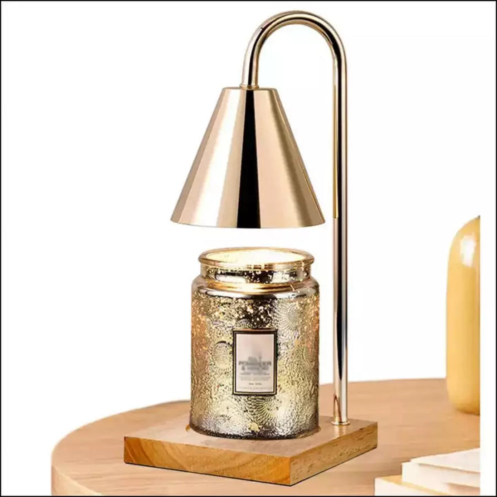 Safety candle warmer lamp illuminating a cozy bedroom decor arrangement