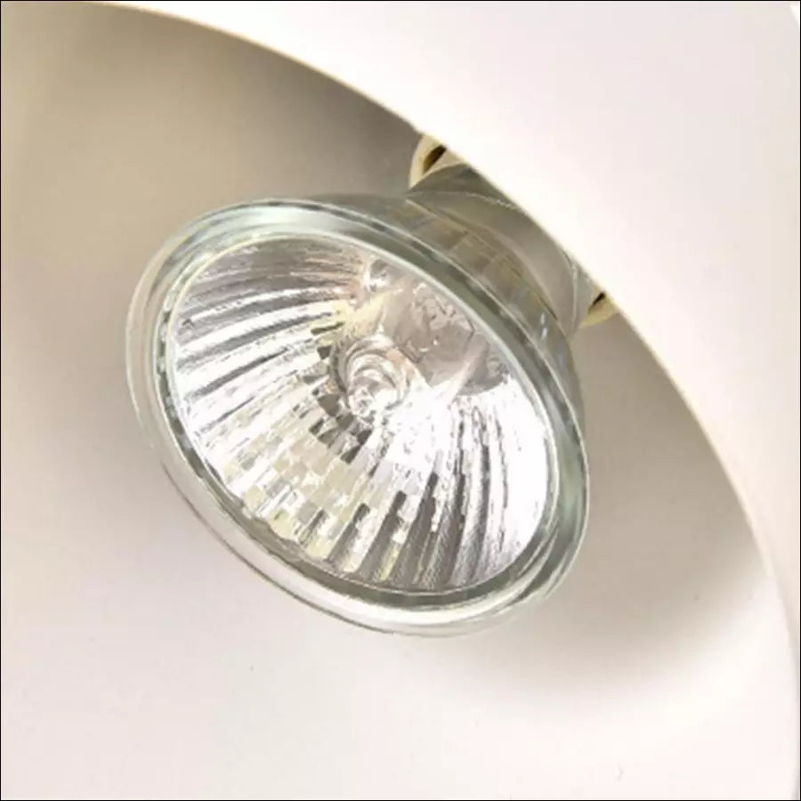 Top-down view of the atmospheric candle warmer lamp showing its sleek metal shade