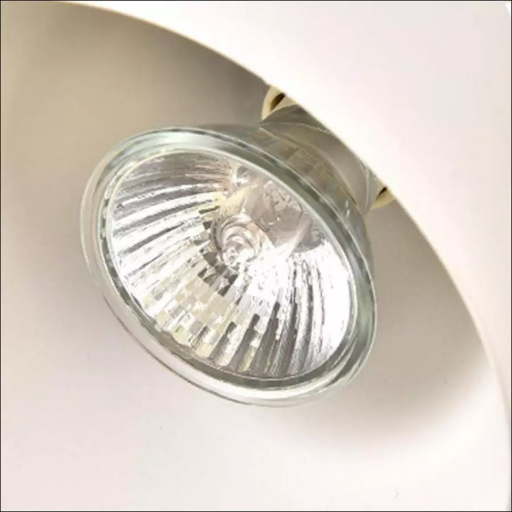 Top-down view of the atmospheric candle warmer lamp showing its sleek metal shade