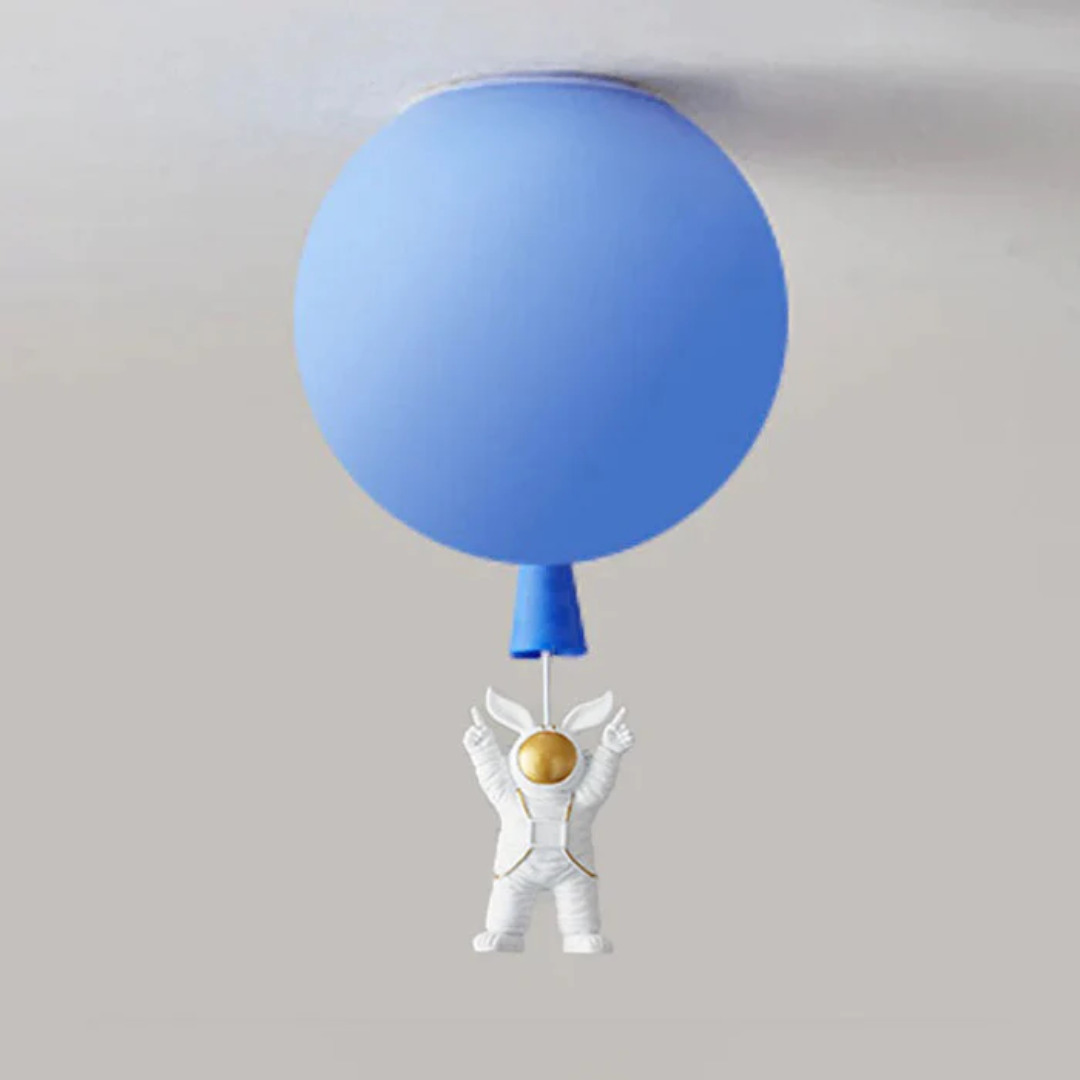 Cute spaceman and moon children light fixture mounted on ceiling
