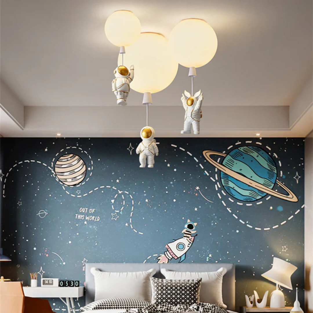 Children's room ceiling light with moon and astronaut figures installed on a star-themed wall