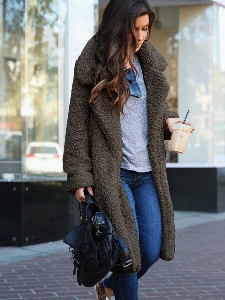 Close-up of soft fluffy texture on women's winter teddy coat