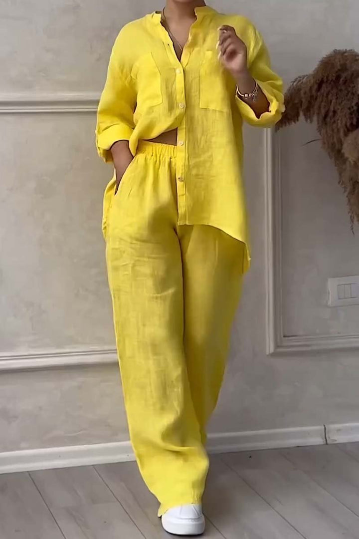 Close-up view of the yellow two-piece blouse and trousers outfit