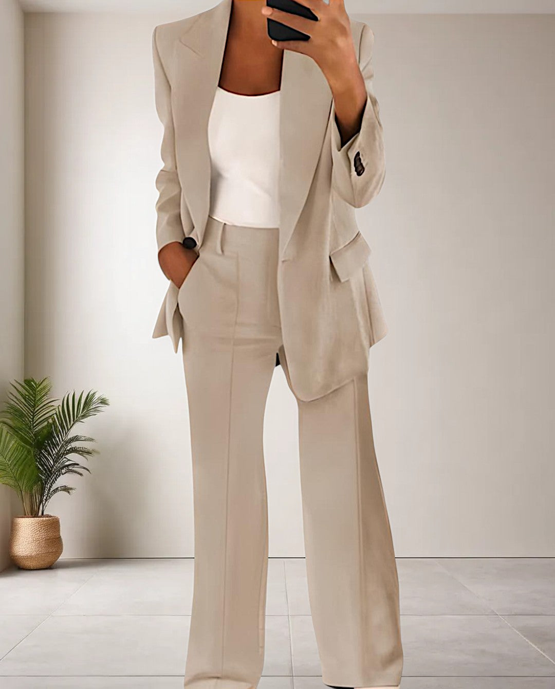 Woman wearing the neutral beige two-piece pantsuit set