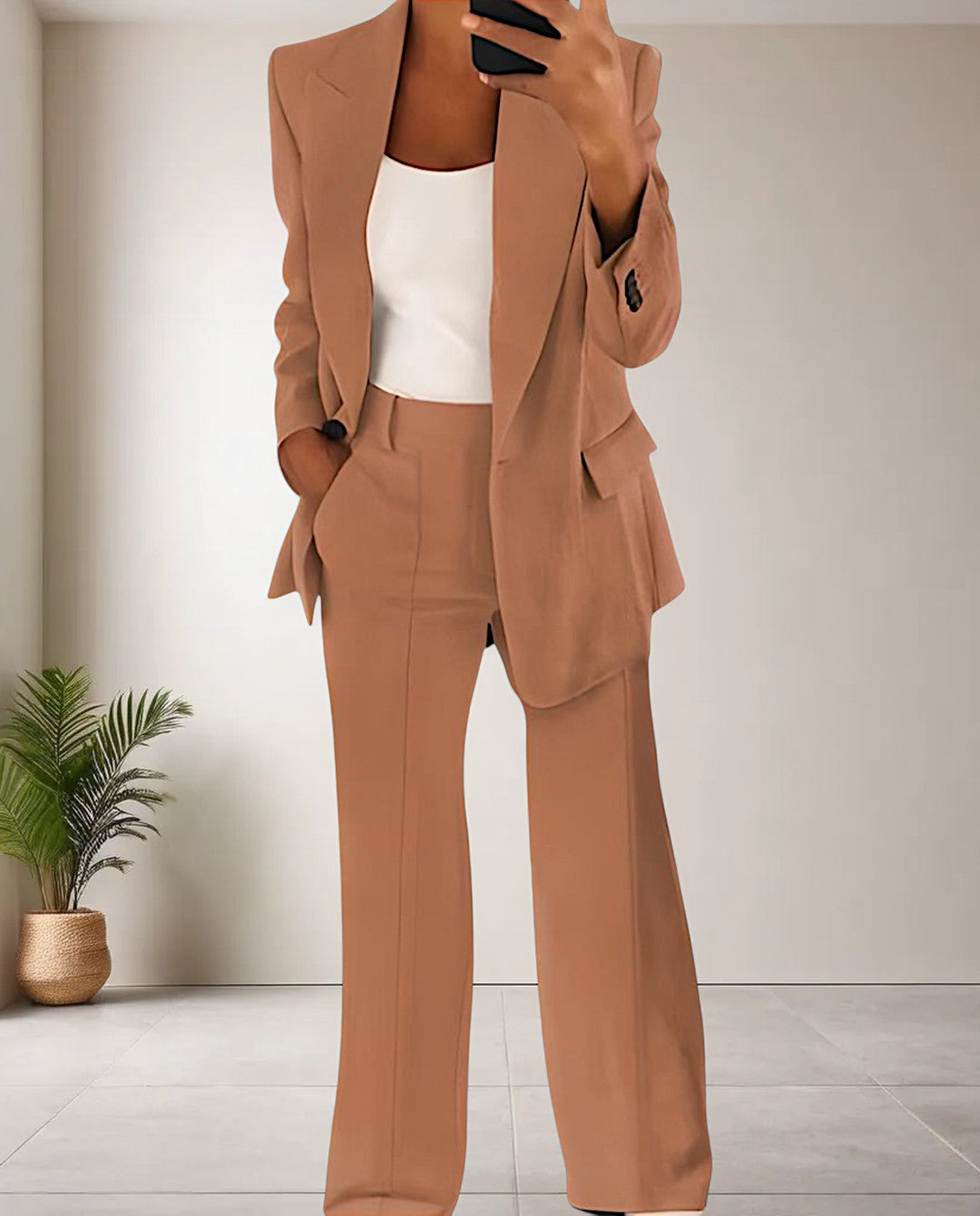 Elegant two-piece women's pantsuit in business casual style, featuring a tailored blazer