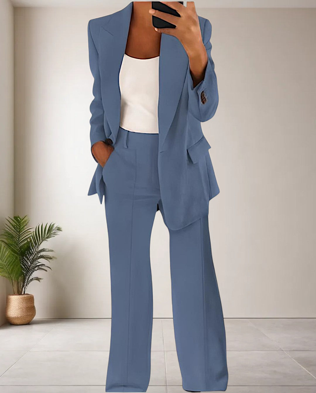 Woman wearing the light blue two-piece pantsuit set