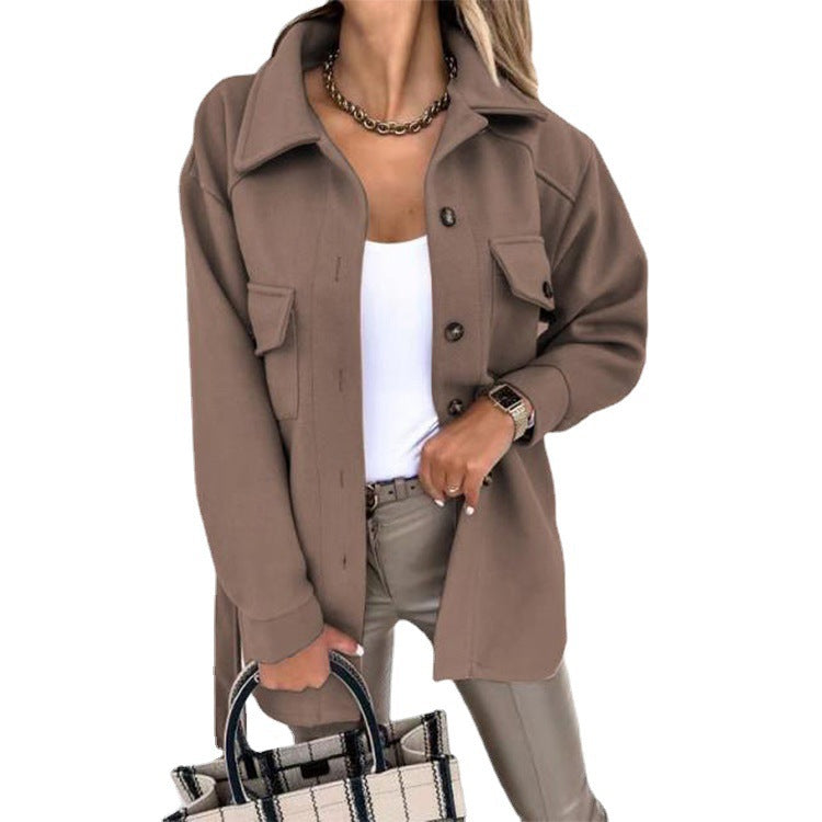 Woman showcasing a stylish brown buttoned windbreaker jacket