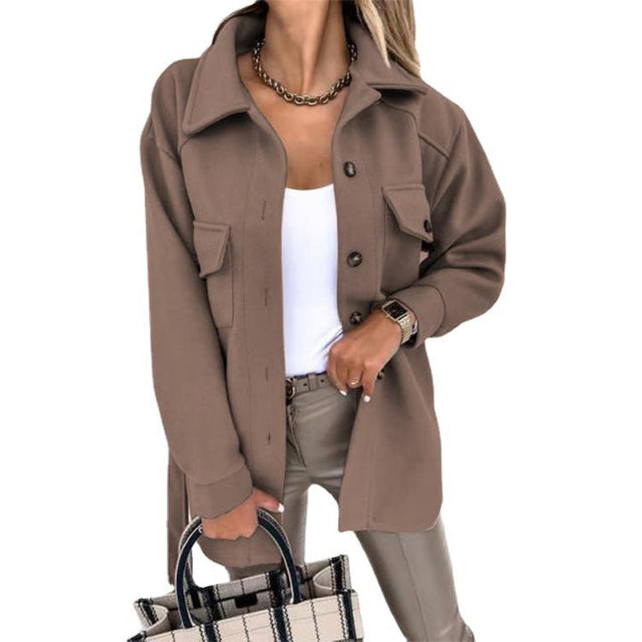 Woman showcasing a stylish brown buttoned windbreaker jacket