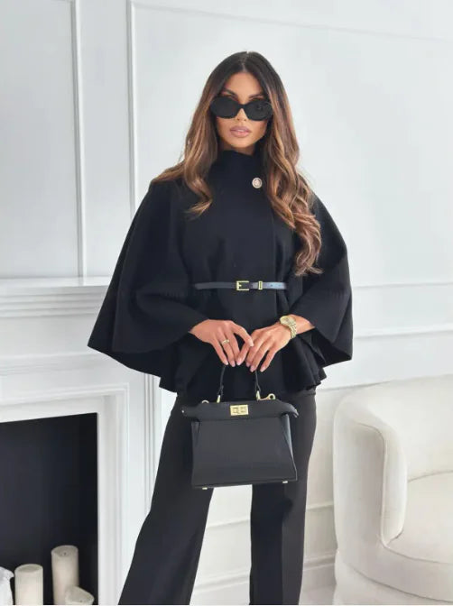 Elegant tailored winter coat in grey worn by a model, showcasing outerwear fashion