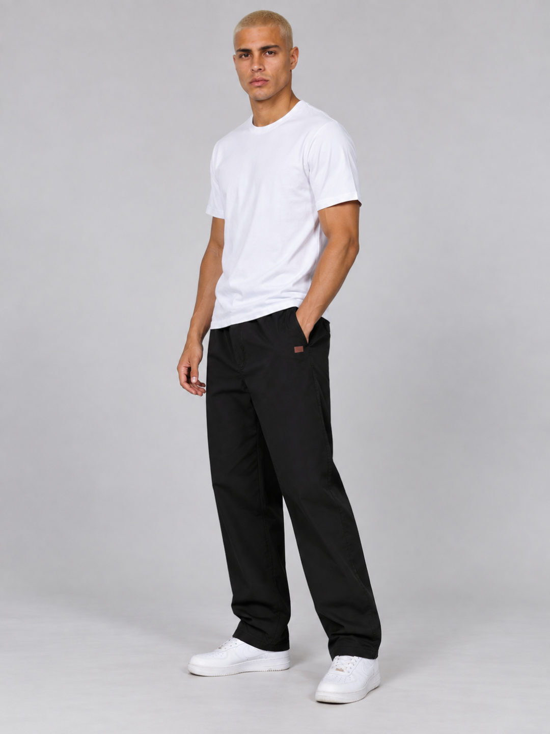 Model standing in profile view highlighting the straight-leg cut and pocket details