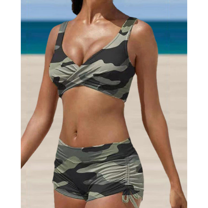 Woman wearing a camouflage two-piece shaping bikini by the beach