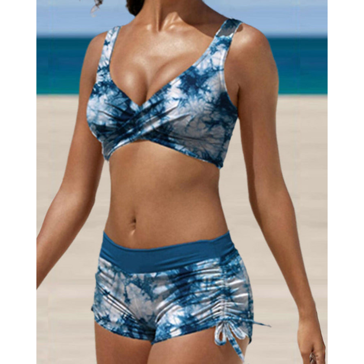 Woman wearing a blue tie-dye two-piece shaping bikini