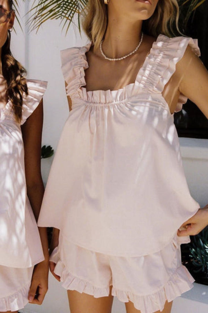 Women wearing the pink summer ruffle pyjama set